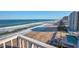 Aerial view showcases beach, ocean, and high-rise buildings at 5203 S Atlantic Ave # 815B, New Smyrna Beach, FL 32169