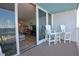 Ocean view balcony with patio furniture and sliding glass doors at 5203 S Atlantic Ave # 815B, New Smyrna Beach, FL 32169