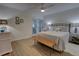 Cozy bedroom with a queen bed and stylish wood bench at 5203 S Atlantic Ave # 815B, New Smyrna Beach, FL 32169