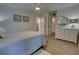 Spacious bedroom with a queen bed and dresser at 5203 S Atlantic Ave # 815B, New Smyrna Beach, FL 32169