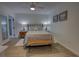 Light and airy bedroom featuring a queen bed and ensuite bathroom at 5203 S Atlantic Ave # 815B, New Smyrna Beach, FL 32169