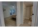 Bright bedroom with light flooring and access to bathroom at 5203 S Atlantic Ave # 815B, New Smyrna Beach, FL 32169