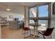 Ocean view dining area with a small table and chairs near window at 5203 S Atlantic Ave # 815B, New Smyrna Beach, FL 32169
