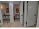 Hallway with light flooring and access to rooms at 5203 S Atlantic Ave # 815B, New Smyrna Beach, FL 32169