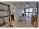 Bright hallway with wood-look floors and decorative shelving at 5203 S Atlantic Ave # 815B, New Smyrna Beach, FL 32169