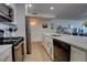 Modern kitchen with stainless steel appliances and an open floor plan at 5203 S Atlantic Ave # 815B, New Smyrna Beach, FL 32169