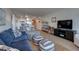 Open living space with ocean view, comfortable seating, and hardwood floors at 5203 S Atlantic Ave # 815B, New Smyrna Beach, FL 32169