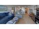 Living area with ocean view, blue sofa, and a stylish rug at 5203 S Atlantic Ave # 815B, New Smyrna Beach, FL 32169