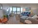Coastal living room with ocean view, comfortable seating, and modern décor at 5203 S Atlantic Ave # 815B, New Smyrna Beach, FL 32169