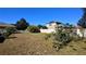 Large backyard with grassy area and trees at 547 Queens Mirror Cir, Casselberry, FL 32707