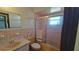 Bathroom with pink tile and shower/tub combo at 547 Queens Mirror Cir, Casselberry, FL 32707
