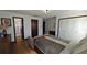 Bedroom with double bed, couch, and en-suite bathroom at 547 Queens Mirror Cir, Casselberry, FL 32707
