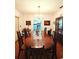 Bright dining room with a large table and chandelier at 547 Queens Mirror Cir, Casselberry, FL 32707