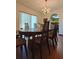 Dining room features a large table and hardwood floors at 547 Queens Mirror Cir, Casselberry, FL 32707