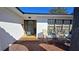 Front entry with gray door and yellow tile flooring at 547 Queens Mirror Cir, Casselberry, FL 32707