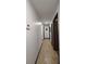 Long hallway with tile floor and access to other rooms at 547 Queens Mirror Cir, Casselberry, FL 32707