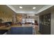 Open concept kitchen with island and gray cabinets at 547 Queens Mirror Cir, Casselberry, FL 32707