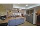 Kitchen features an island with seating and gray cabinets at 547 Queens Mirror Cir, Casselberry, FL 32707