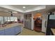 Kitchen with island, gray cabinets, and open layout at 547 Queens Mirror Cir, Casselberry, FL 32707