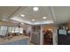 Open kitchen with island, gray cabinets, and a view into the living room at 547 Queens Mirror Cir, Casselberry, FL 32707