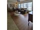 Living room boasts hardwood floors and ample natural light at 547 Queens Mirror Cir, Casselberry, FL 32707