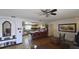 Living room with hardwood floors and view of kitchen at 547 Queens Mirror Cir, Casselberry, FL 32707