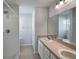 Bathroom with double sinks and shower at 7207 Summit Pl, Winter Haven, FL 33884