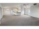 Open living room with high ceilings and kitchen access at 7207 Summit Pl, Winter Haven, FL 33884