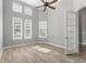 Neutral bedroom features high ceilings, wood look floors and plantation shutters at 7613 Debeaubien Dr, Orlando, FL 32835