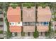 Aerial view of three townhomes with patios and garages at 8451 Leatherleaf Ln, Orlando, FL 32827