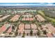 Aerial community view with lake and numerous houses at 8451 Leatherleaf Ln, Orlando, FL 32827