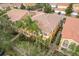 Aerial view of a townhome with surrounding landscape at 8451 Leatherleaf Ln, Orlando, FL 32827