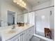 Bathroom with double vanity, shower, and toilet at 8451 Leatherleaf Ln, Orlando, FL 32827