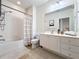 Bathroom with shower/tub combo and white vanity at 8451 Leatherleaf Ln, Orlando, FL 32827