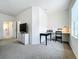 Home office space with a desk and window in bedroom at 8451 Leatherleaf Ln, Orlando, FL 32827