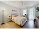 Bright bedroom with ceiling fan and access to balcony at 8451 Leatherleaf Ln, Orlando, FL 32827