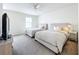 Two twin beds in bright bedroom with ceiling fan at 8451 Leatherleaf Ln, Orlando, FL 32827