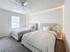 Bedroom with two twin beds and lighted headboard at 8451 Leatherleaf Ln, Orlando, FL 32827