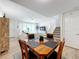 Bright dining room adjacent to living room and kitchen at 8451 Leatherleaf Ln, Orlando, FL 32827