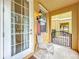 Small front porch with a chair and a view of the courtyard at 8451 Leatherleaf Ln, Orlando, FL 32827