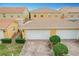 Rear view of two-car garage with paver driveway at 8451 Leatherleaf Ln, Orlando, FL 32827