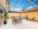 Spacious covered patio with seating and a dining area at 8451 Leatherleaf Ln, Orlando, FL 32827