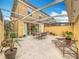 Covered patio with seating area and fire pit feature at 8451 Leatherleaf Ln, Orlando, FL 32827
