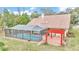Property boasts a large pool, pergola, and lush green space at 8520 Sw 209Th Ct, Dunnellon, FL 34431
