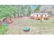 Large backyard with shed, fire pit, and wood pile at 8520 Sw 209Th Ct, Dunnellon, FL 34431