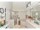 Bright and airy bathroom with shower, soaking tub, and large mirror at 8520 Sw 209Th Ct, Dunnellon, FL 34431