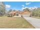 Charming one story home featuring a two-car garage and an inviting brick entryway at 8520 Sw 209Th Ct, Dunnellon, FL 34431