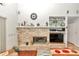 Brick fireplace with built-in shelving and entertainment center at 8520 Sw 209Th Ct, Dunnellon, FL 34431