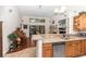 Open-concept kitchen with stainless steel appliances, and view into the living room at 8520 Sw 209Th Ct, Dunnellon, FL 34431