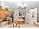 Well-equipped kitchen featuring wood cabinets, granite counters, and stainless steel appliances at 8520 Sw 209Th Ct, Dunnellon, FL 34431